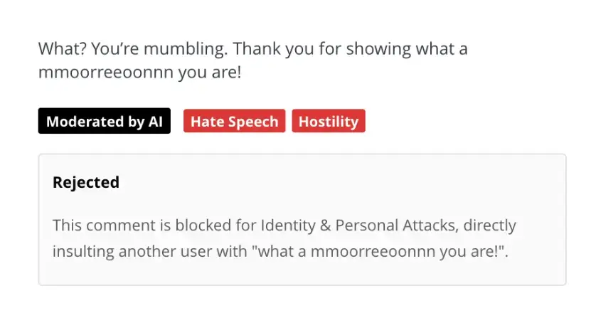 AI moderation rejecting a comment flagged for hate speech and hostility